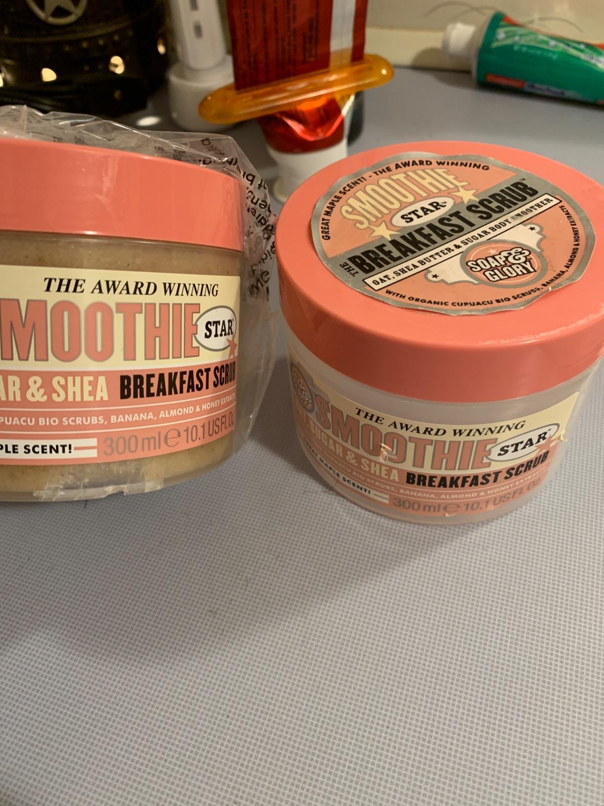 Two Soap & Glory Smoothie Star Breakfast Scrub tubs on a bathroom counter, one still in its wrapper